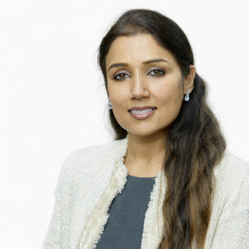 Poonam Kahlon Leath Instructor Lady in blue blouse with cardigan and long brown hair pulled back draping over the sholder